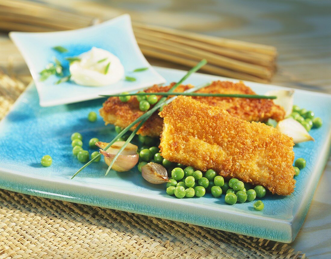 Cod fillets in cornflake panade with peas