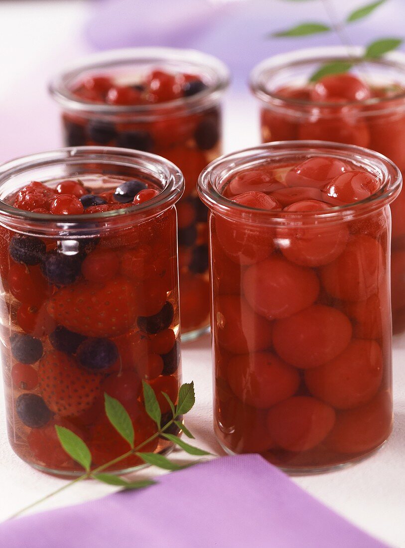 Cherries in sherry and berries in Cassis in preserving jars