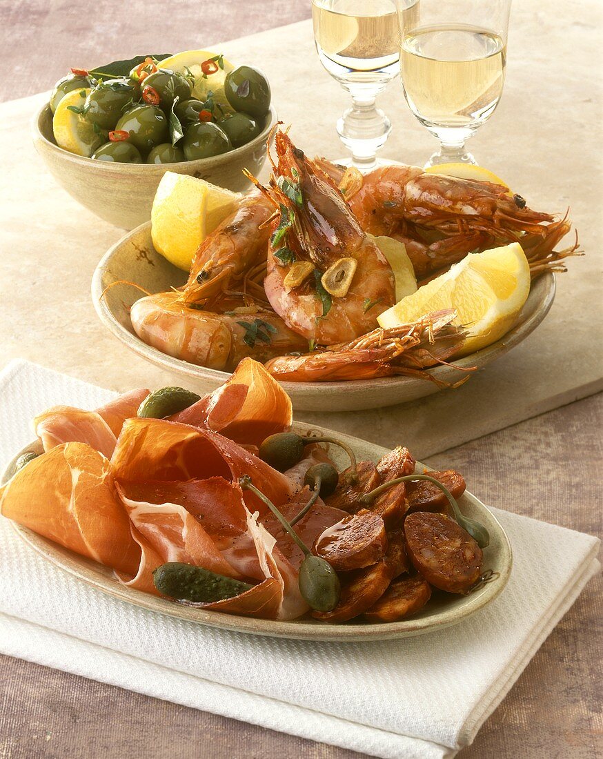 Tapas: ham, chorizo, capers, garlic shrimps and olives