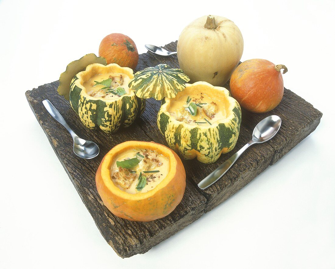 Pumpkin soup with toasted croutons, served in pumpkins