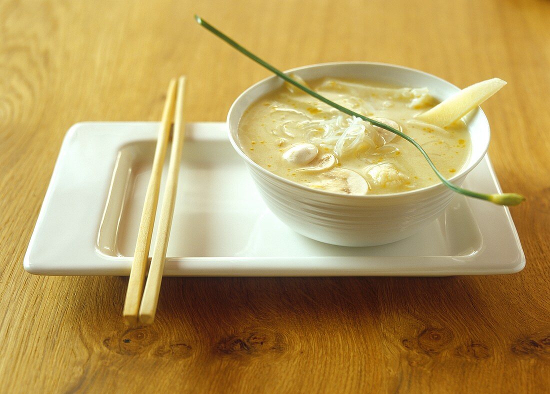 Asian cauliflower soup with glass noodles and mushrooms
