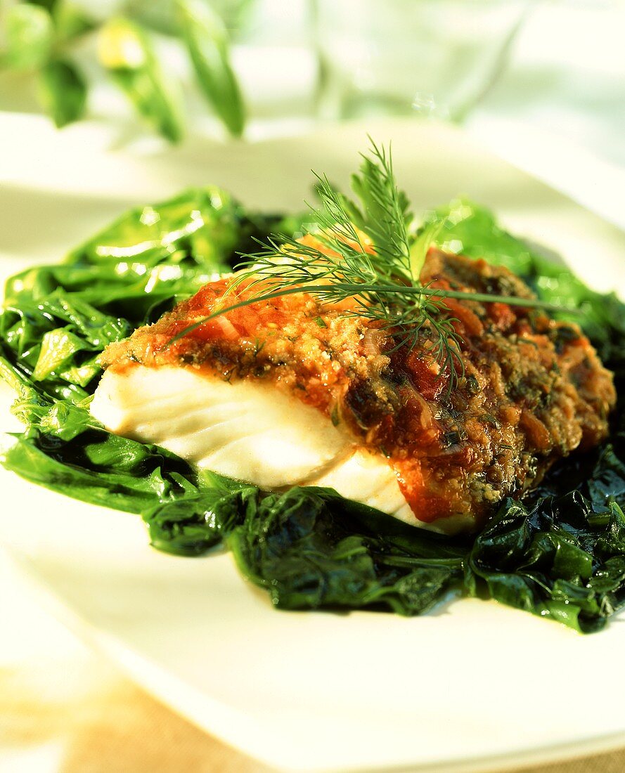 Alaska pollock fillet with herb crust on spinach