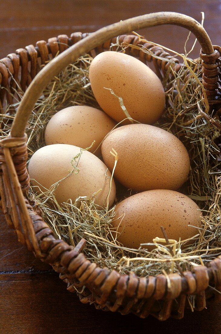 Brown hen's eggs in a basket 