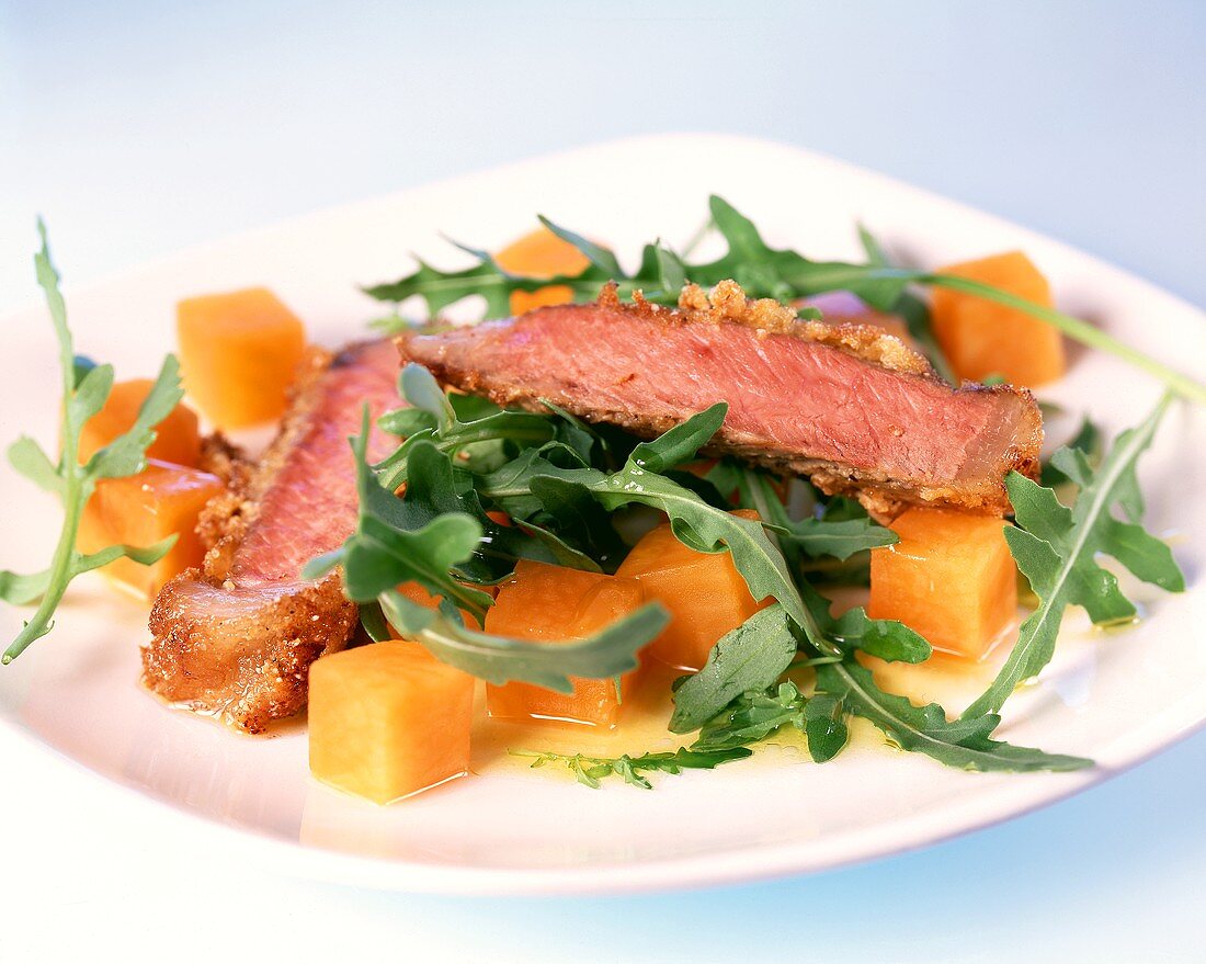 Entrecote on rocket with diced pumpkin