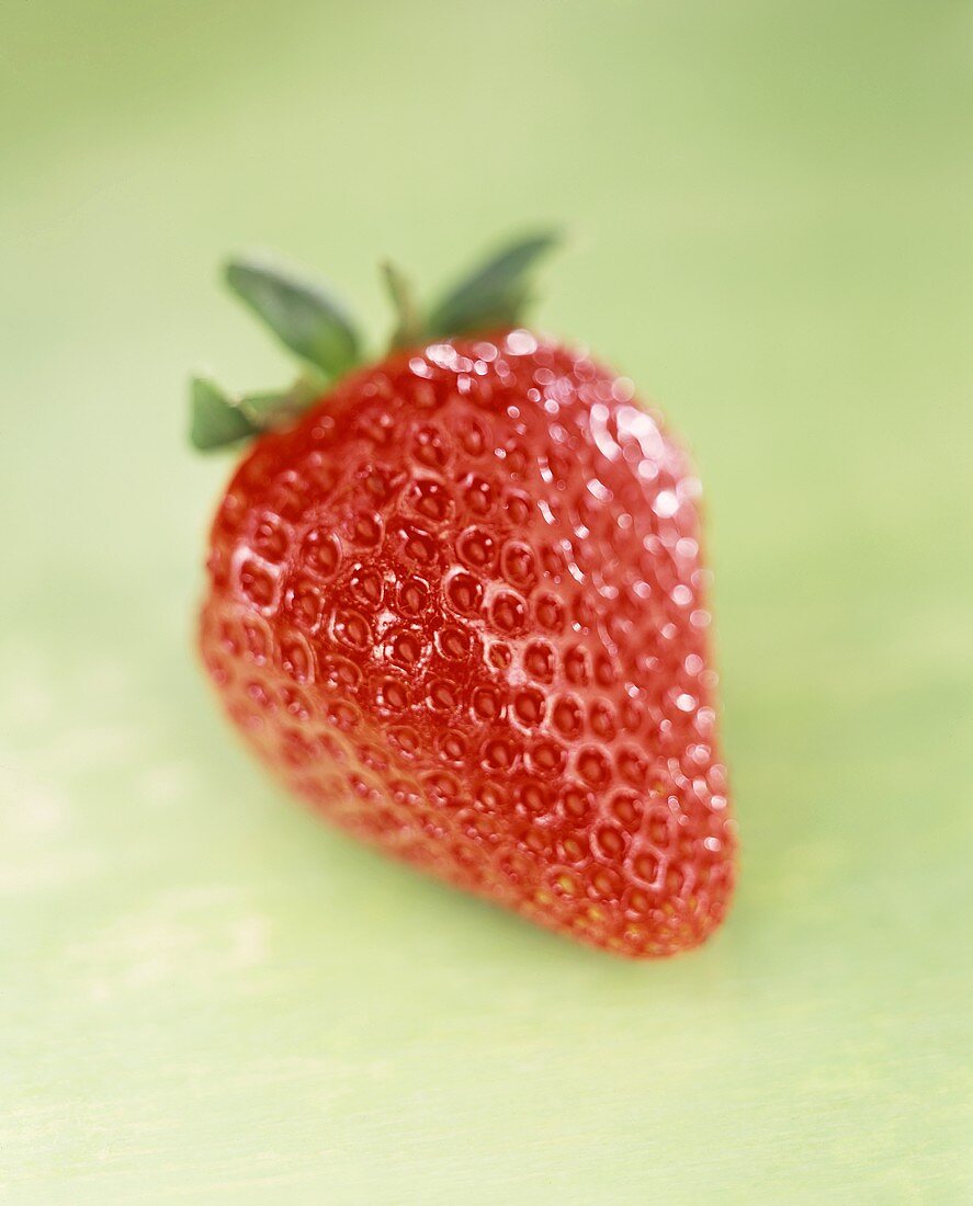 Strawberry on green background