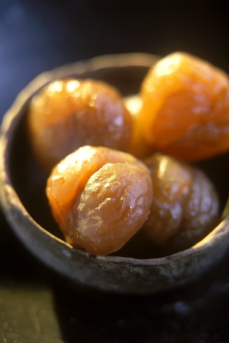 Terracotta bowl of candied sweet chestnuts