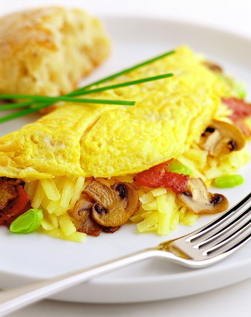 Omelette with cheese, mushrooms and bacon