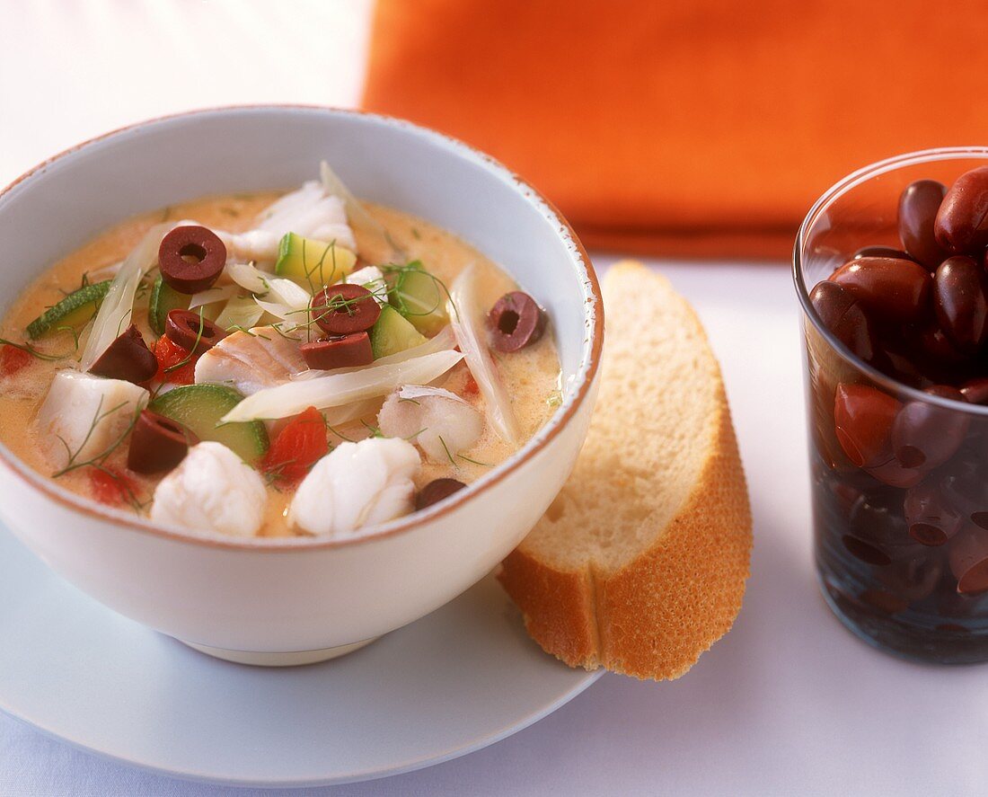 Fish stew with olives and white bread