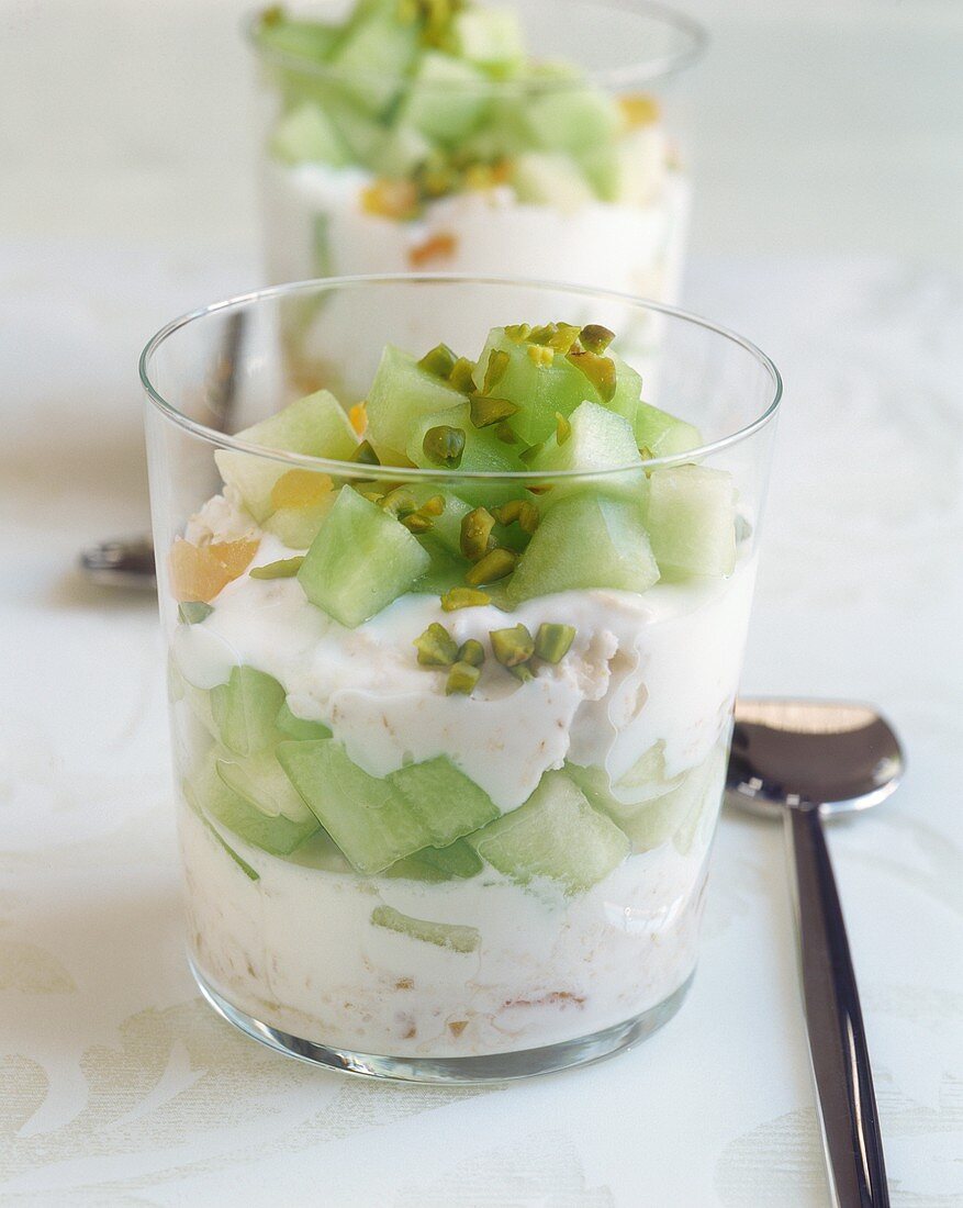 Melon yoghurt with rice flakes and pistachios