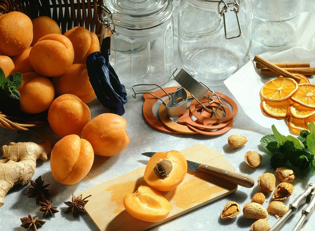 Still life with apricots, almonds, preserving jars etc.