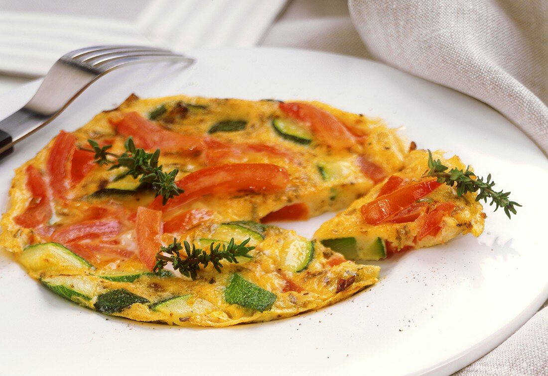 Omelette with tomatoes and courgettes