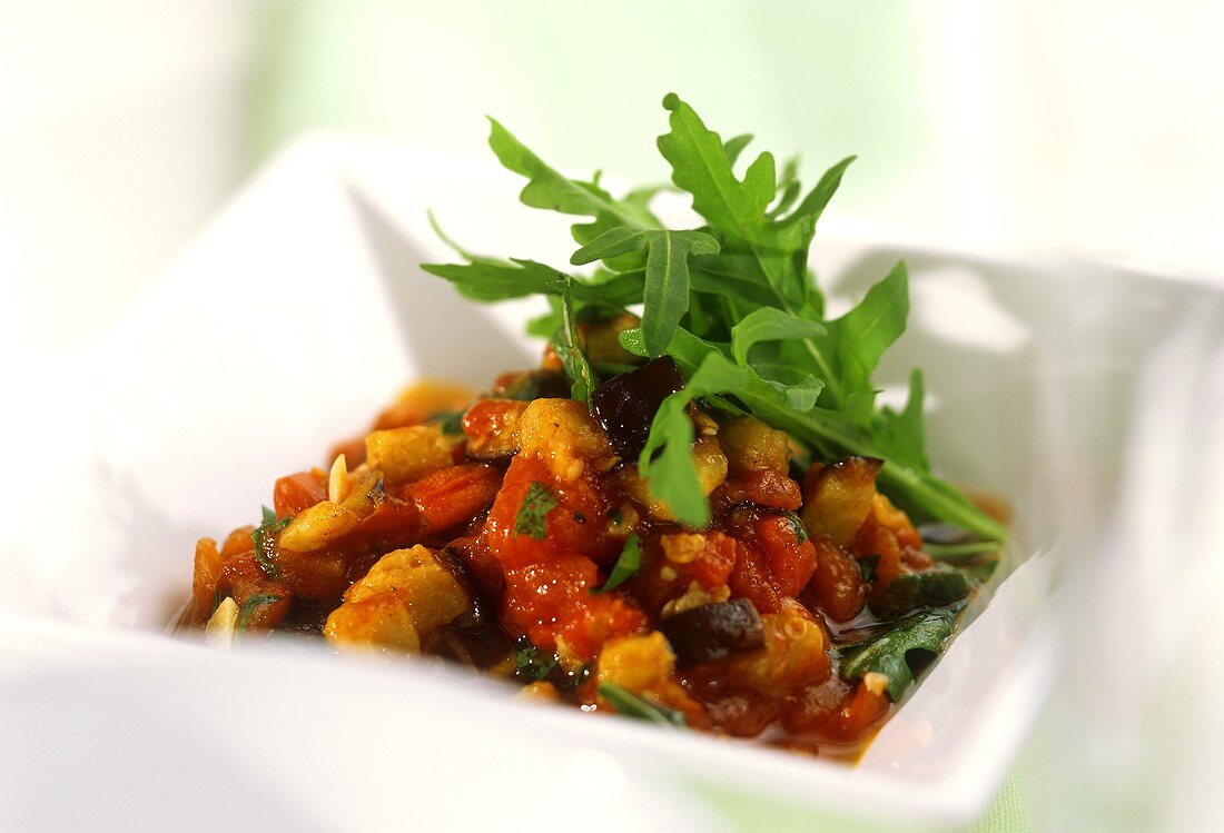 Aubergines and rocket with tomatoes