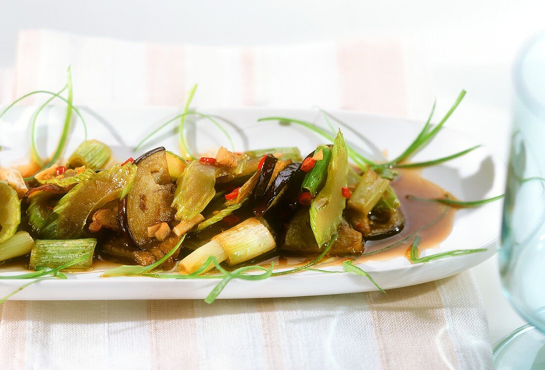 Wok-cooked aubergines with celery and spring onions