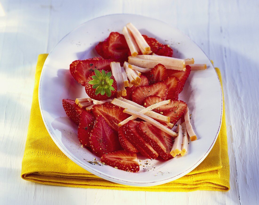 Smoked turkey breast on strawberries