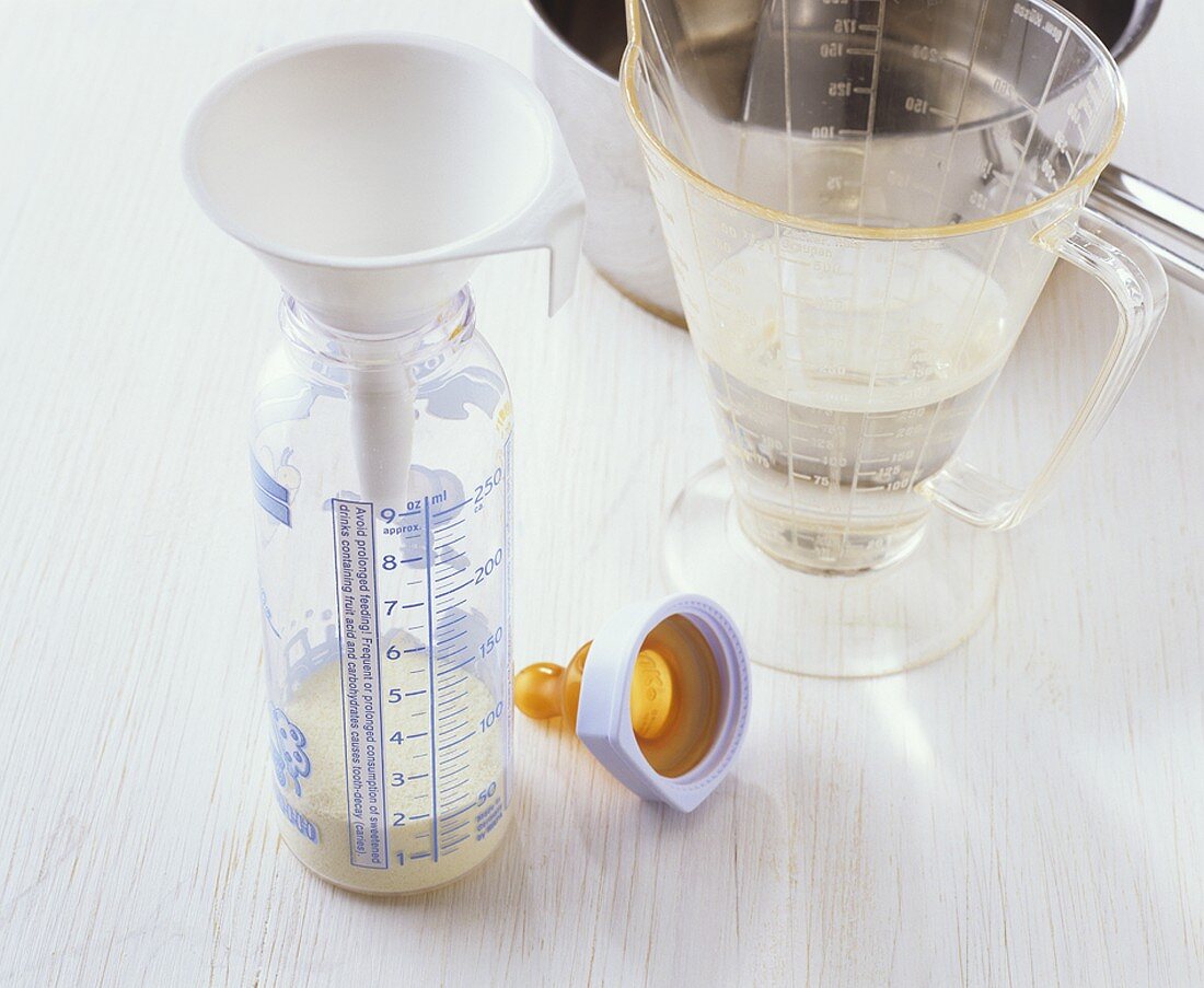 Preparing baby food: mixing powder with water