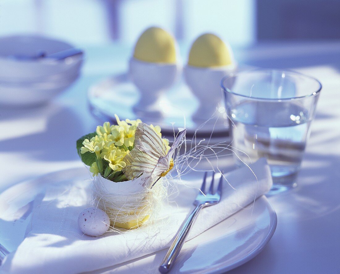 Table setting with flower-filled eggshell