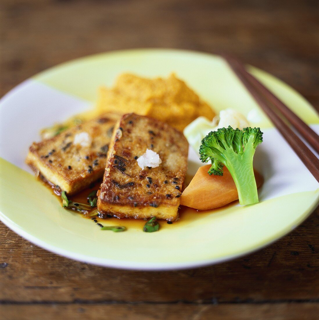 Fried tofu slices with black sesame