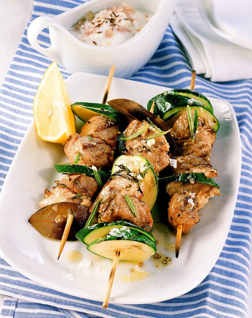 Lamb and courgette kebabs, yoghurt and onion sauce behind