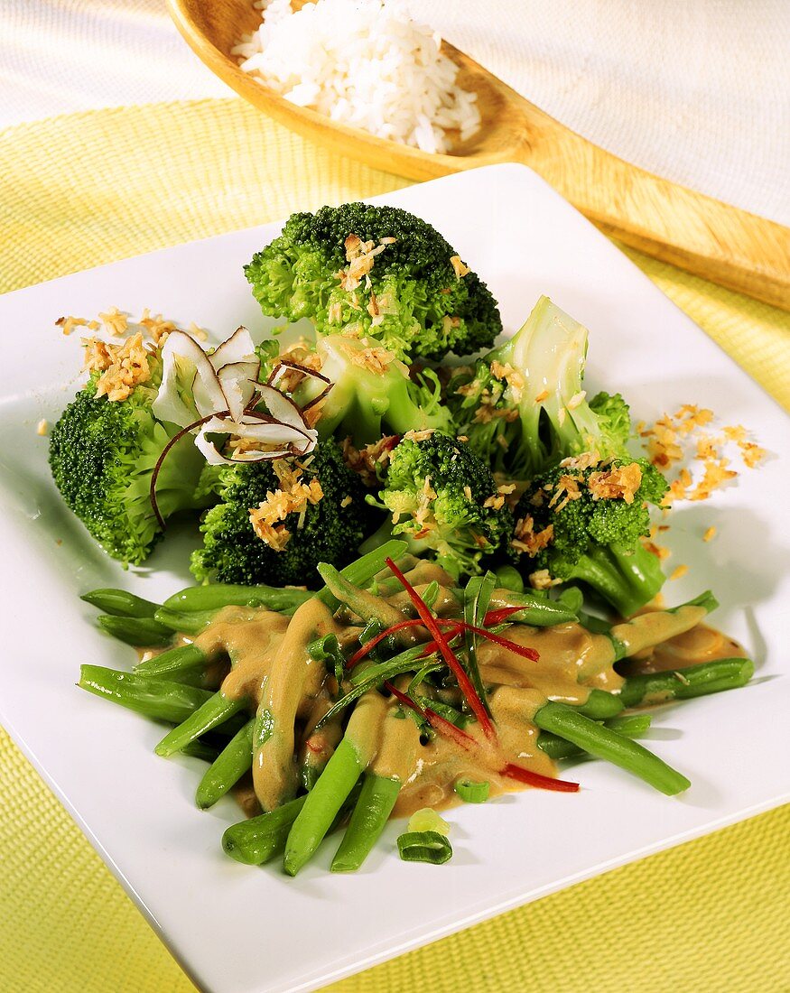 Green beans with chili strips; broccoli with coconut sauce
