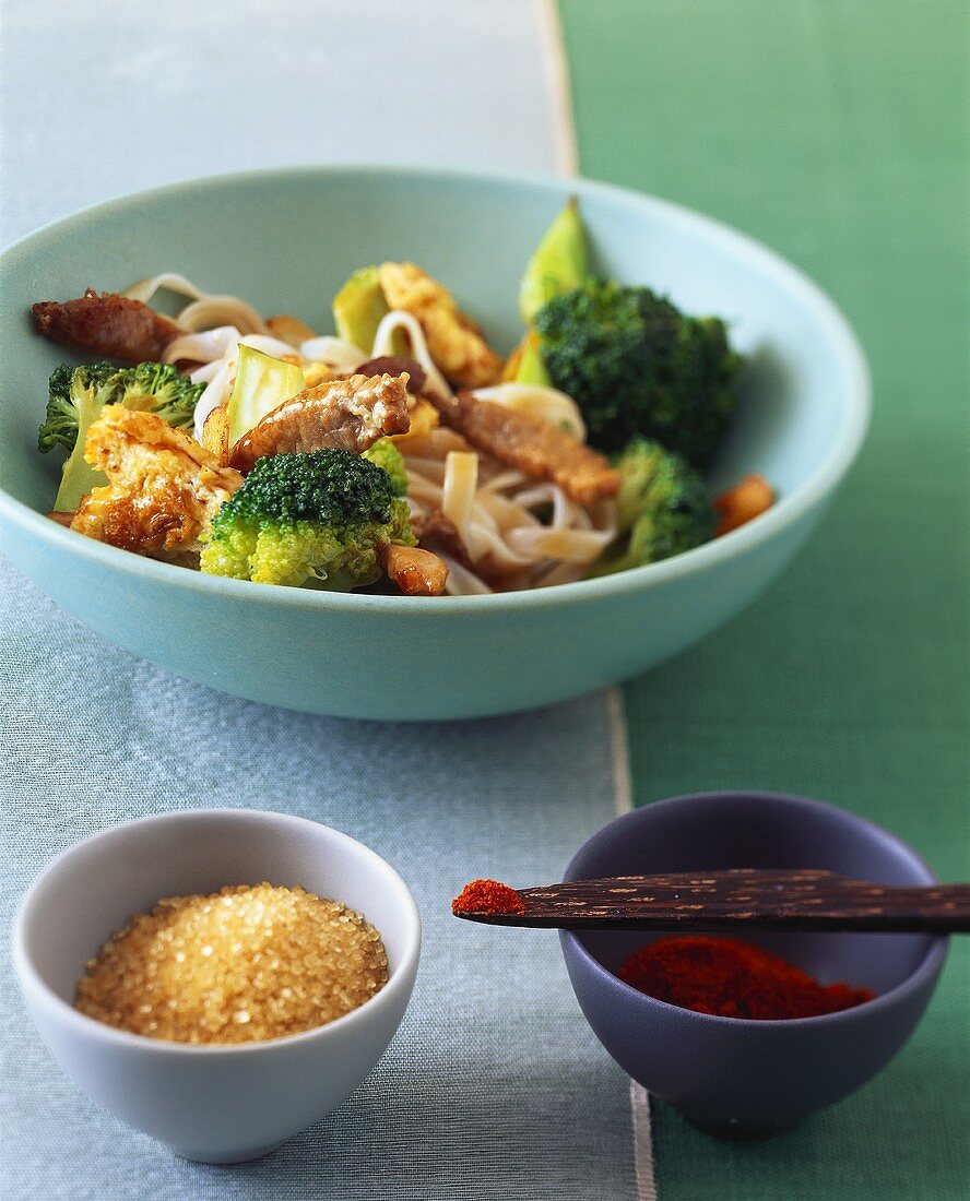 Rice noodles with broccoli and pork; sugar; chili