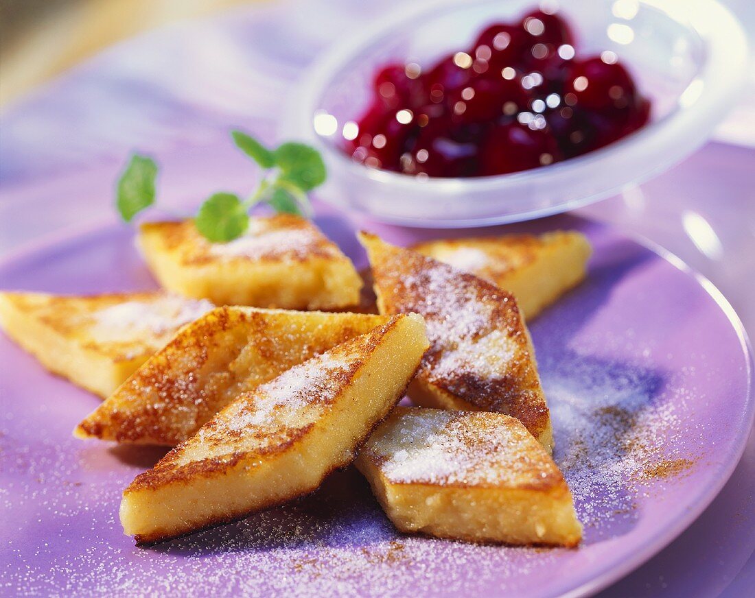 Fried semolina slices with cherries