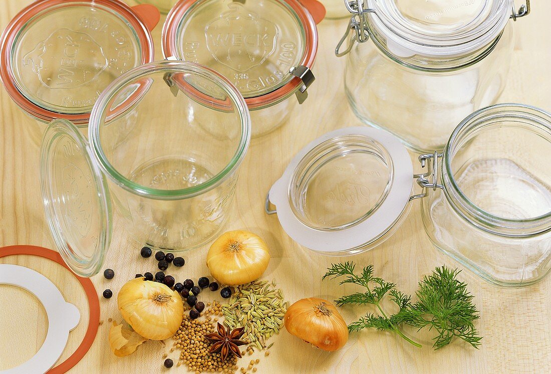 Empty preserving jars, spices, onions and dill