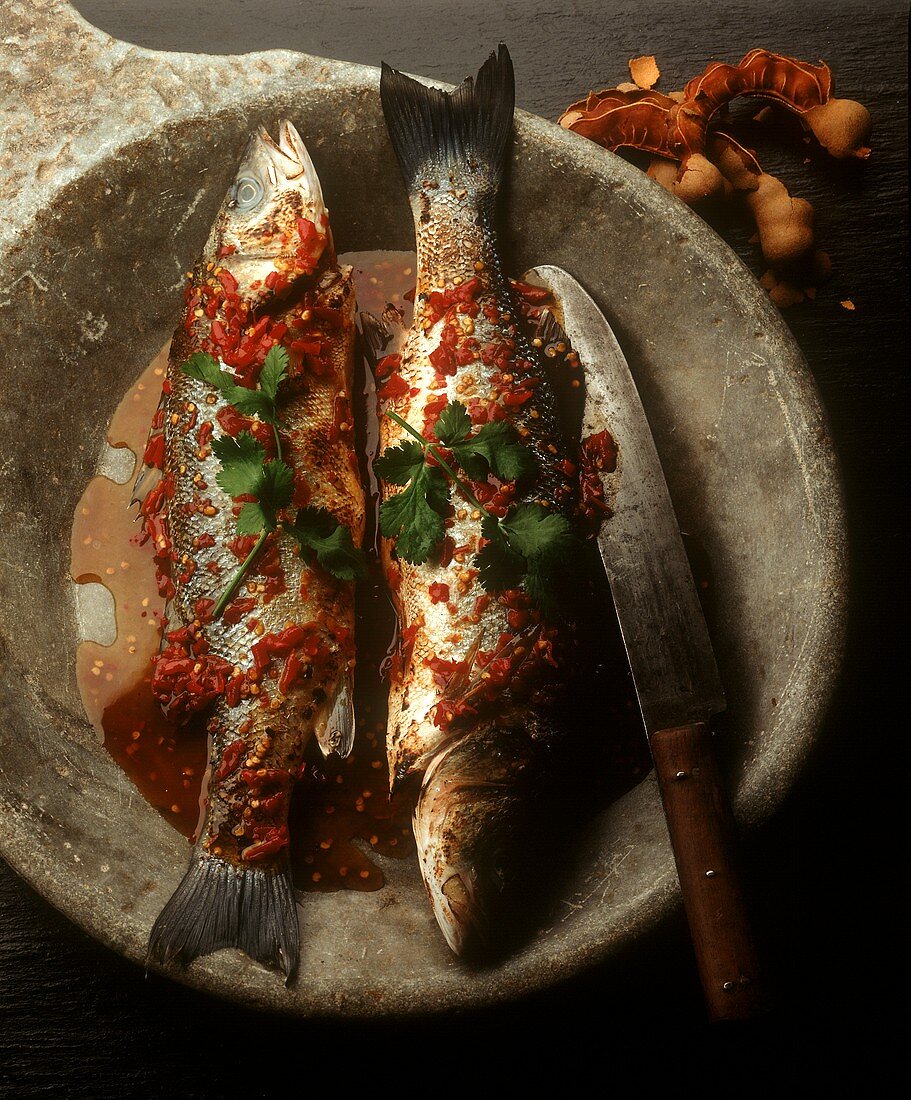 Roast trout in chili & tamarind stock with coriander