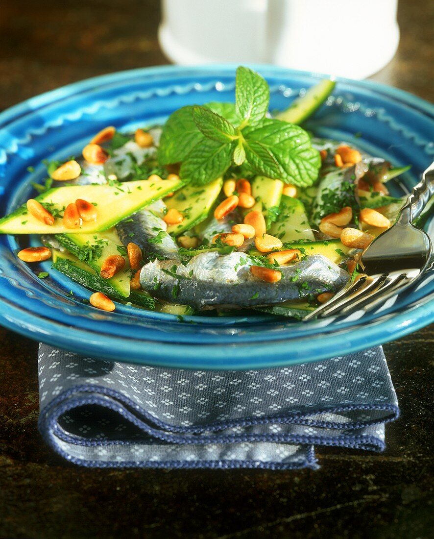 Marinated courgettes with sardine fillets and pine nuts