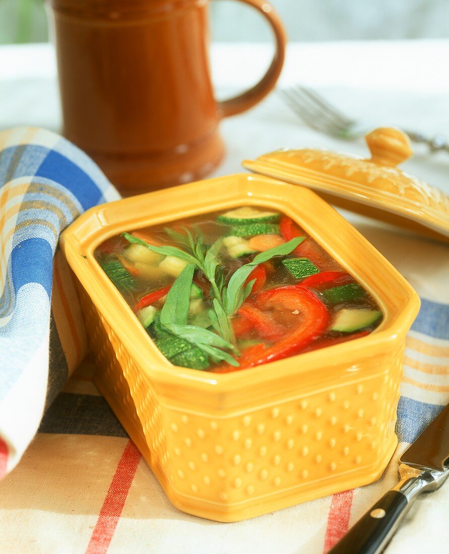 Jellied vegetables in a yellow terrine