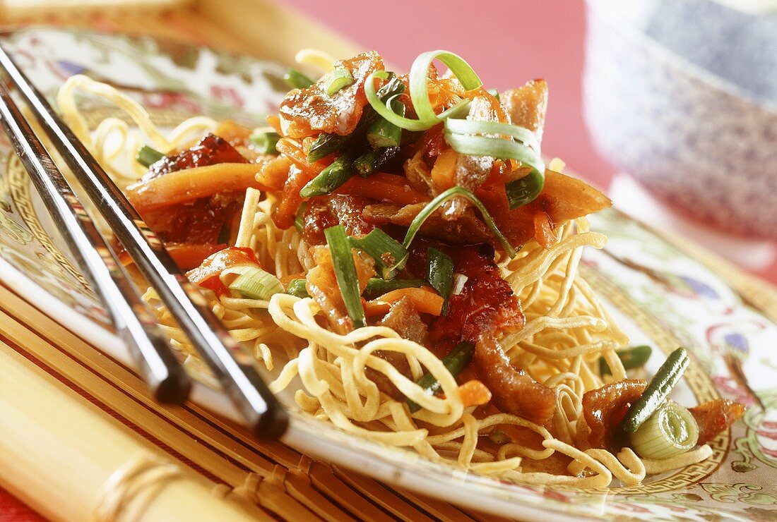 Deep-fried egg noodles with gingered pork, from the wok