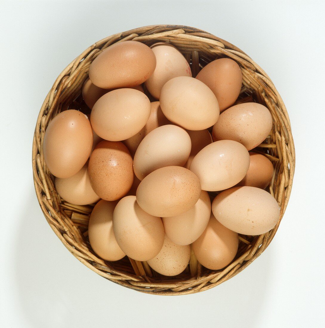Fresh brown hen's eggs in a basket