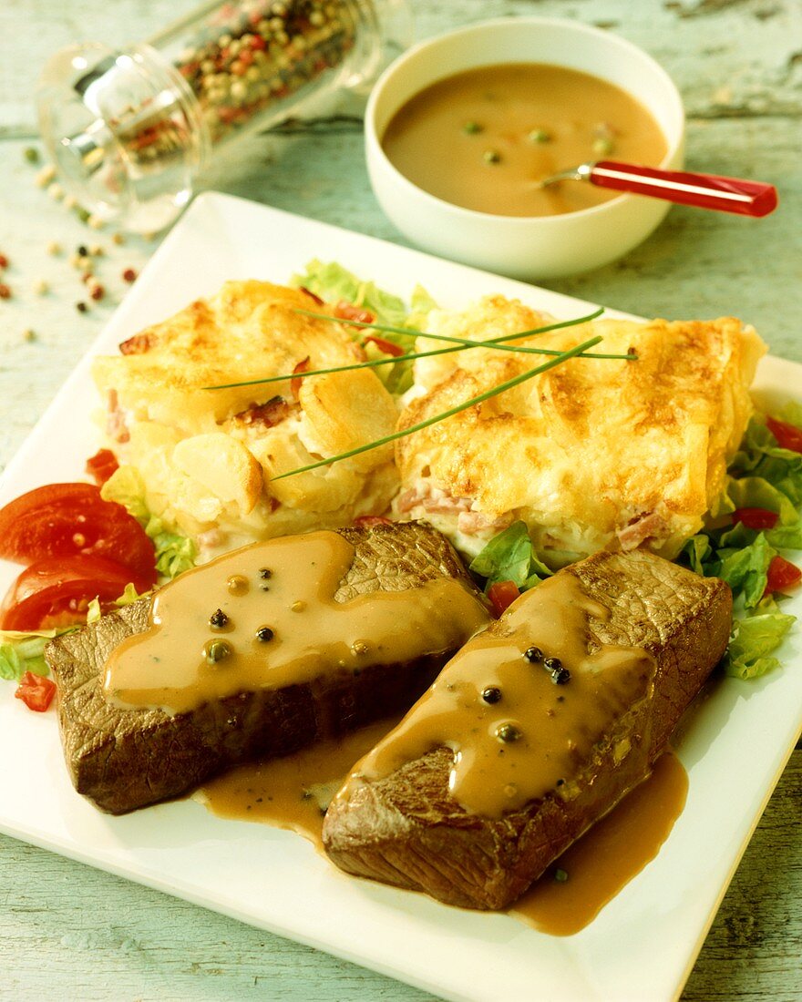 Rump steak with green pepper sauce and potato gratin