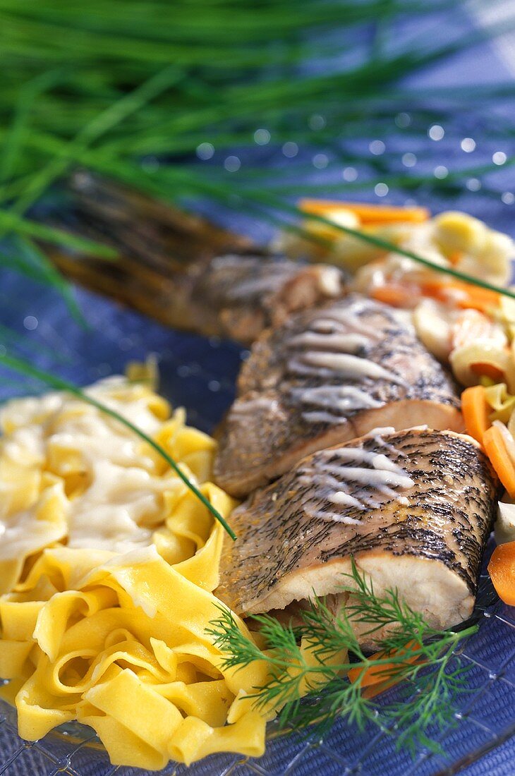 Pike with vegetables and ribbon pasta