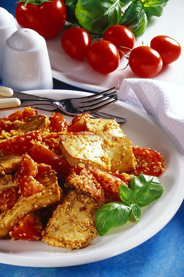 Fried tofu with sesame and tomatoes