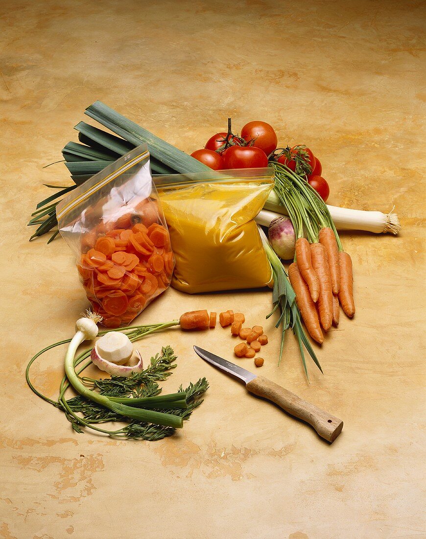 Ready-made carrot soup in freezer bag, ingredients beside it