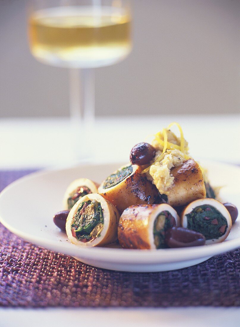 Cuttlefish rings stuffed with olives, parsley and spinach