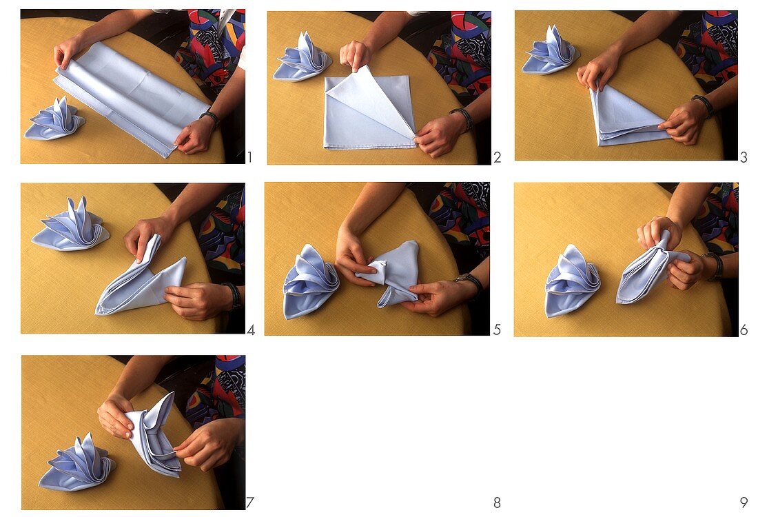 Folding blue fabric napkins into napkin boats 