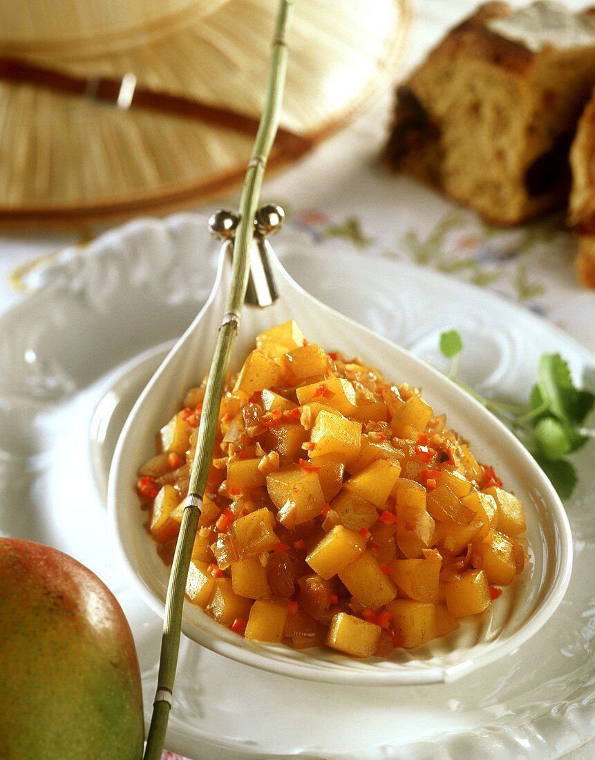 Spicy mango salad with chili and curry 