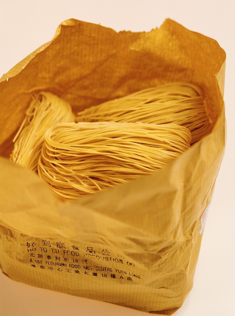 Asian egg noodles in a paper bag