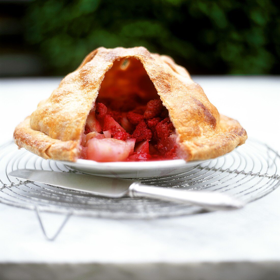 Fruit pie with a piece of crust removed