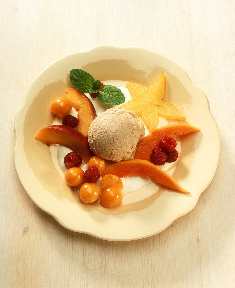 Peanut ice cream with fruit garnish