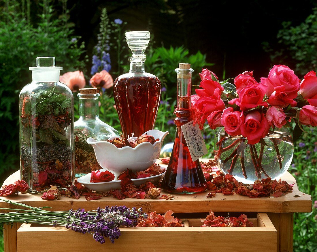 Still life with herbs, flowers and body vinegar