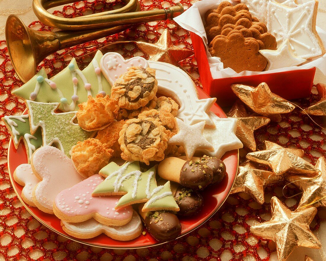 Colourful plate of biscuits and box of biscuits