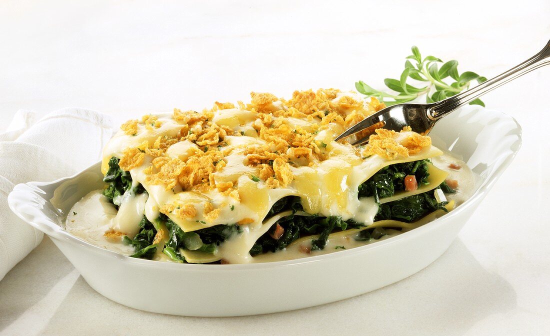 Spinach and ham lasagne with cornflake and cheese topping