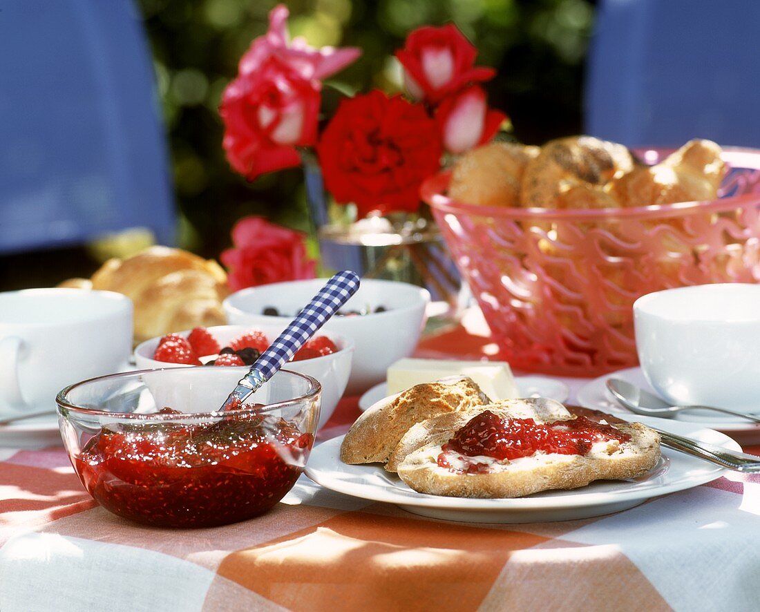Breakfast table with rolls, raspberry jam etc.
