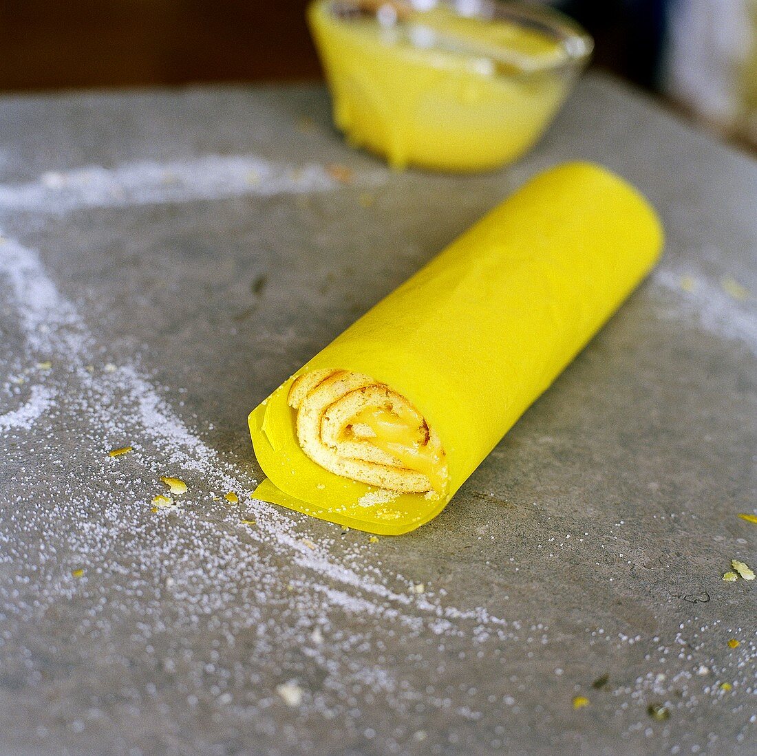 Lemon sponge roulade, a slice cut
