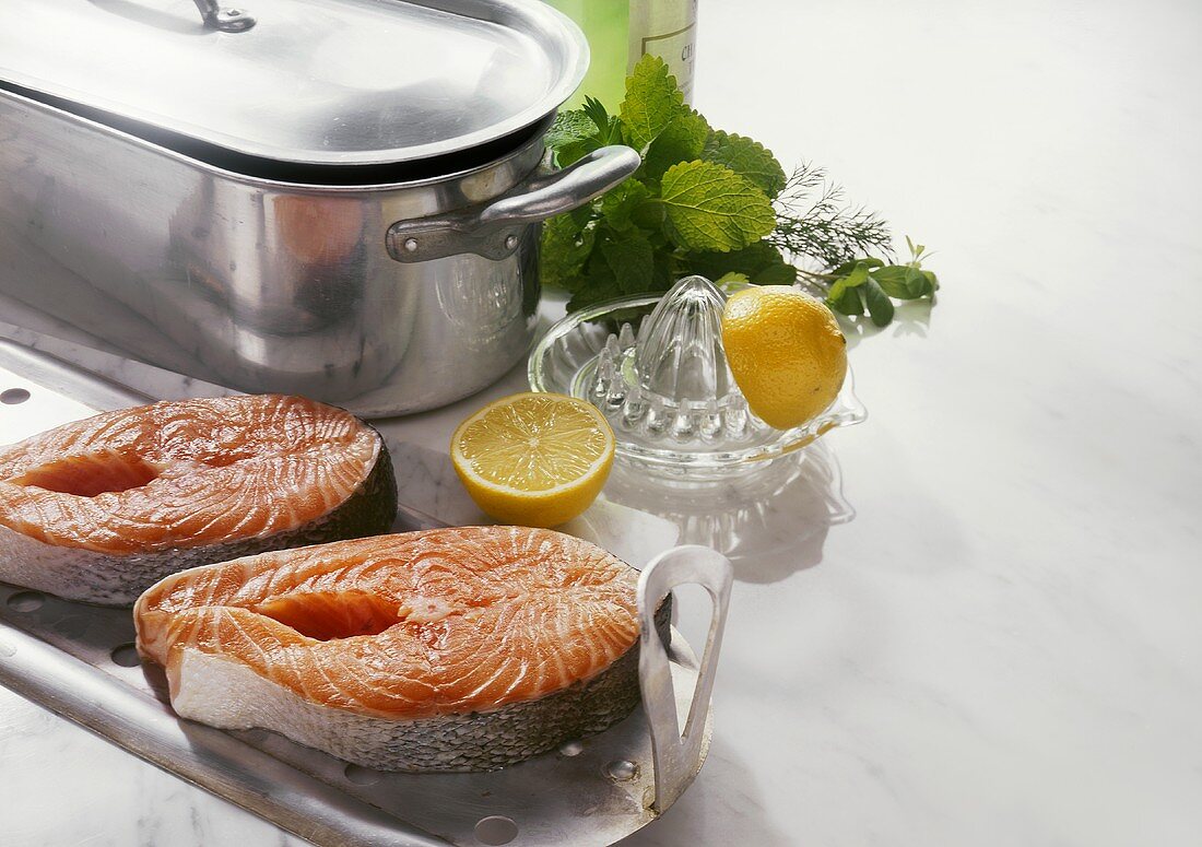 Two salmon steaks in front of a fish kettle