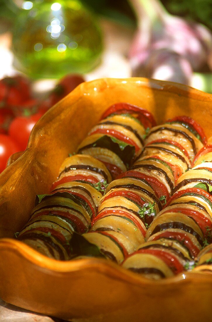 Colourful vegetable bake with courgettes, tomatoes & aubergines