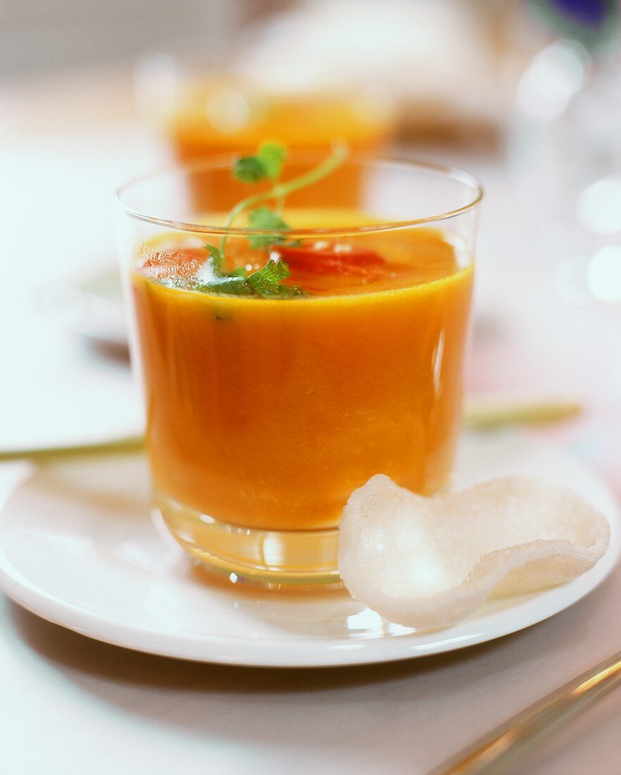 Carrot & orange soup with ginger, coriander & chili in glass