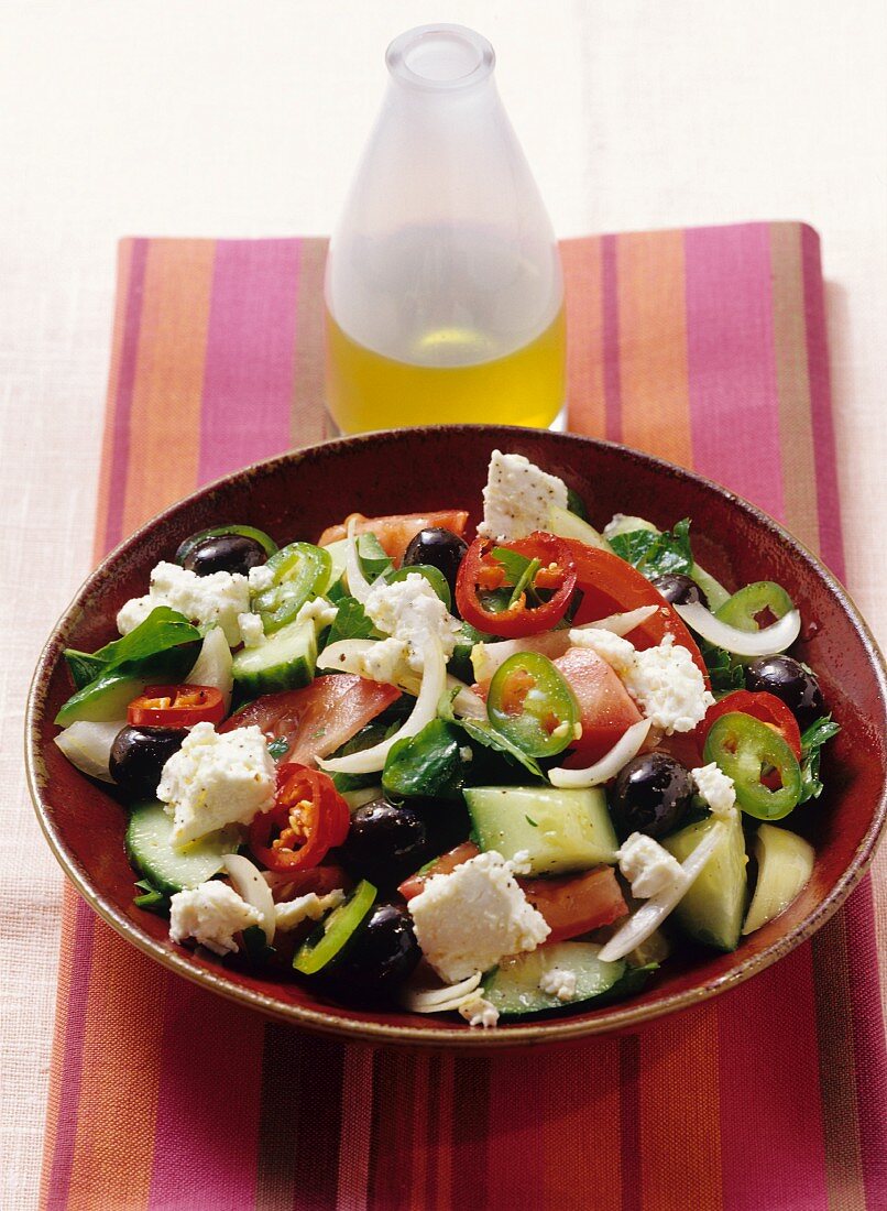 Greek salad with sheep's cheese served with sesame seed bread